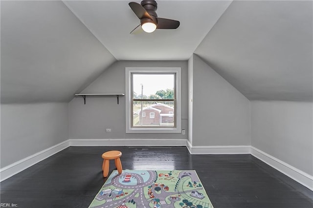 bonus room with ceiling fan, dark hardwood / wood-style flooring, and vaulted ceiling