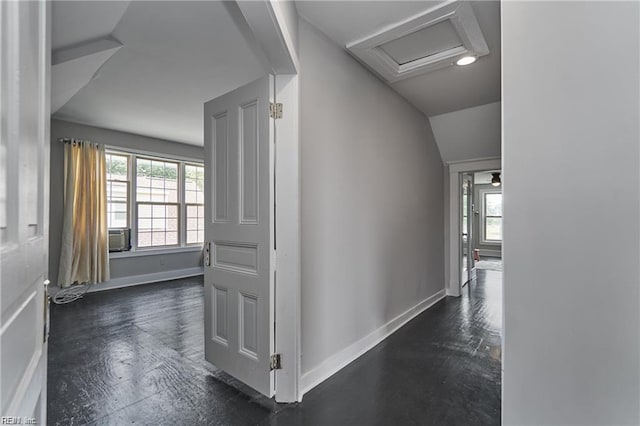 hallway with lofted ceiling