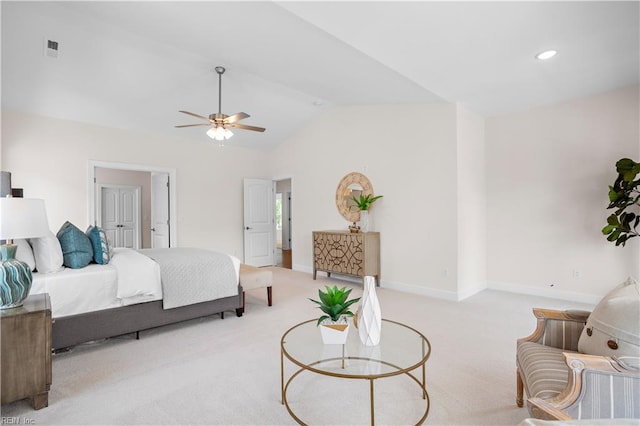 bedroom featuring ceiling fan, light colored carpet, and vaulted ceiling