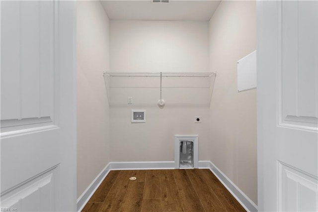 laundry room featuring electric dryer hookup, gas dryer hookup, dark hardwood / wood-style flooring, and washer hookup