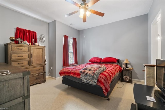 bedroom featuring ceiling fan and light colored carpet