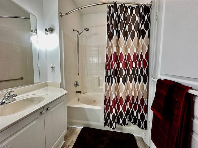 bathroom with shower / bath combo with shower curtain, vanity, and hardwood / wood-style floors