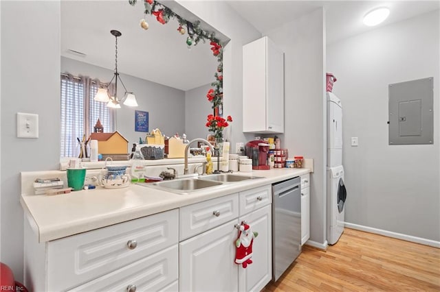 kitchen with dishwasher, sink, hanging light fixtures, stacked washing maching and dryer, and electric panel