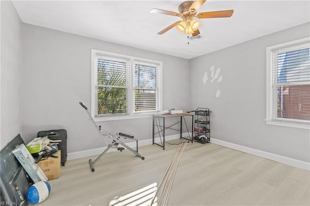 miscellaneous room with light hardwood / wood-style floors, plenty of natural light, and ceiling fan