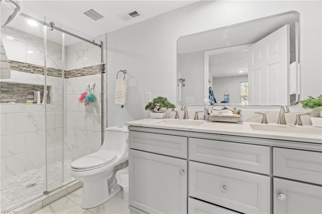 bathroom featuring vanity, toilet, and walk in shower