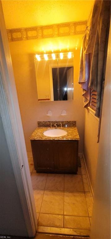 bathroom with vanity and tile patterned flooring