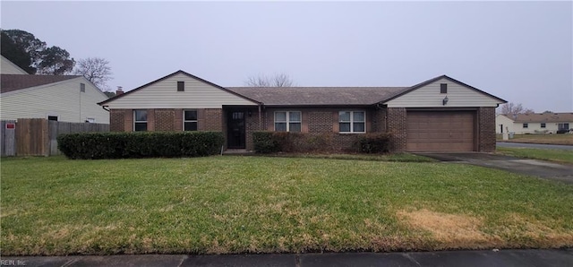 ranch-style home with a front yard and a garage