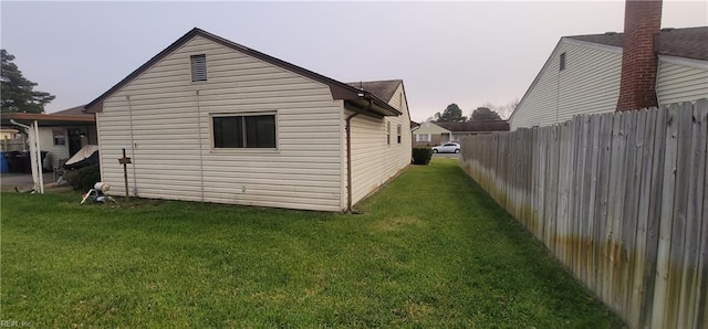 view of property exterior featuring a yard