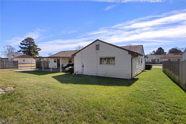 back of property featuring a yard and a patio