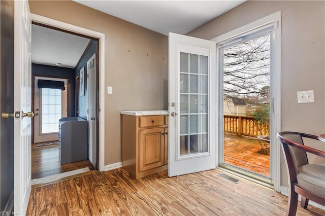 doorway featuring light hardwood / wood-style floors