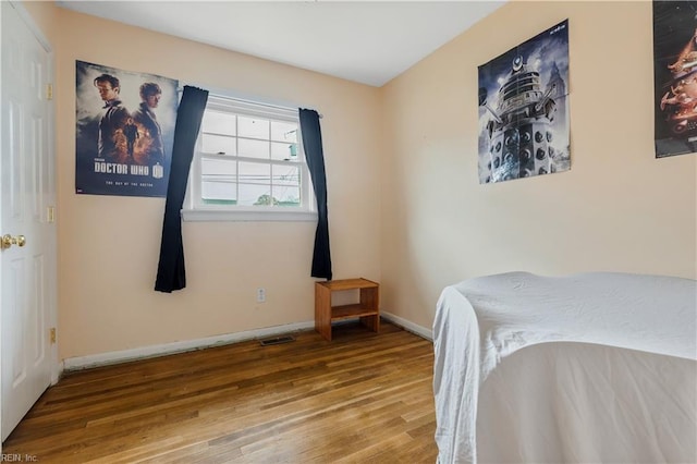 bedroom with wood-type flooring