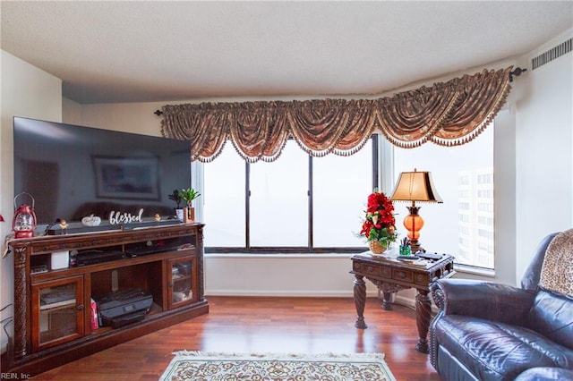 living area featuring hardwood / wood-style floors