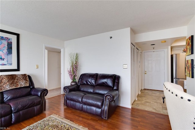 living room with dark hardwood / wood-style flooring