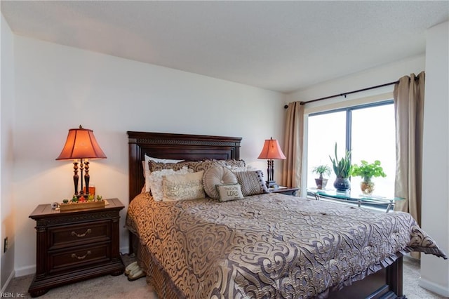 bedroom with light colored carpet