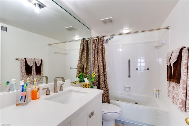 full bathroom featuring vanity, shower / bath combo with shower curtain, and toilet