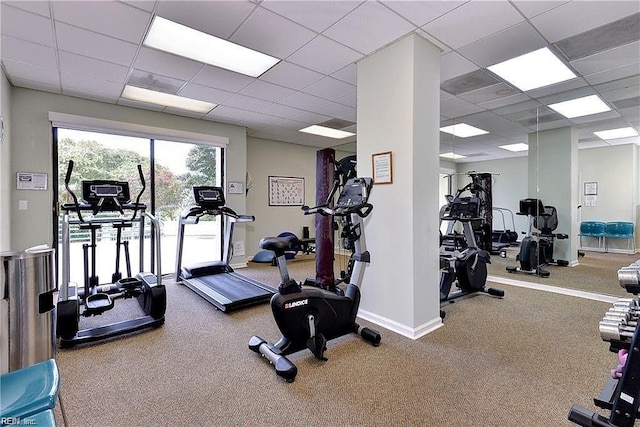 workout area with a paneled ceiling