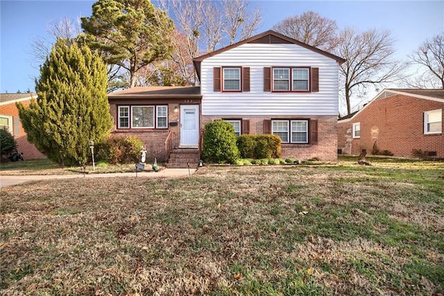 split level home with a front yard