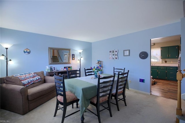 dining room with light wood-type flooring