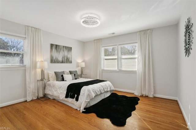 bedroom featuring wood-type flooring