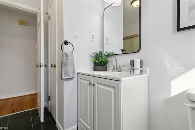 bathroom featuring tile patterned flooring and vanity