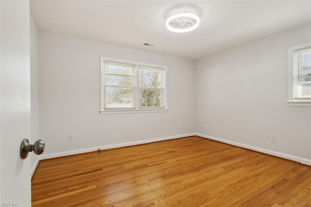 unfurnished room with light hardwood / wood-style floors