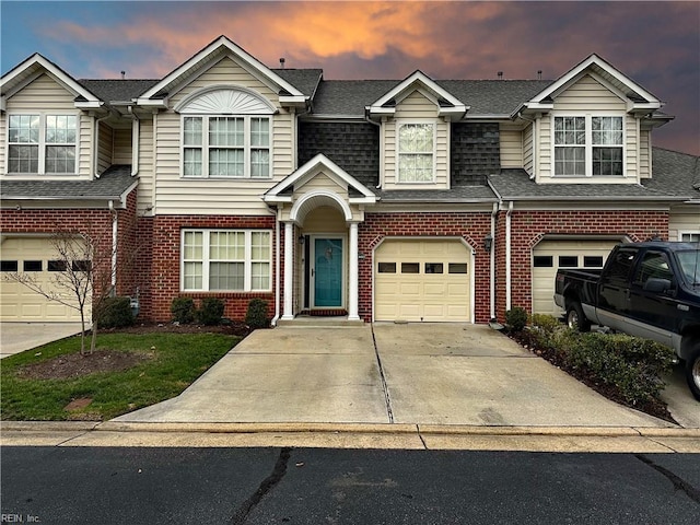 townhome / multi-family property featuring a garage