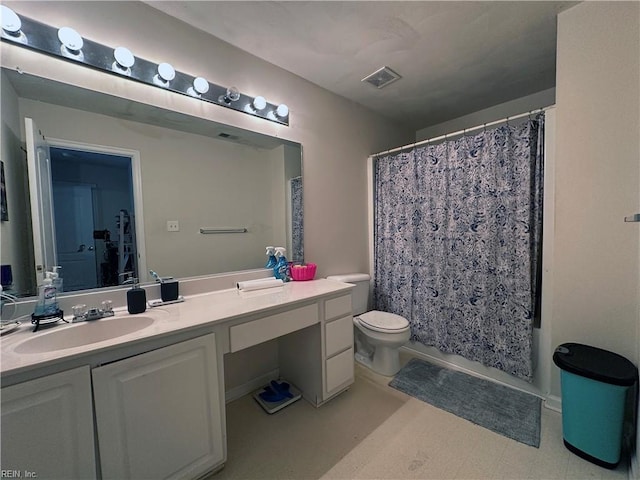 full bathroom featuring vanity, toilet, and shower / bathtub combination with curtain