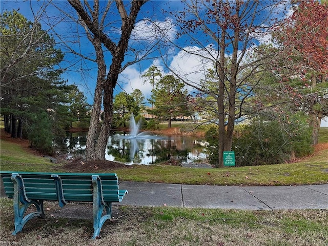 exterior space featuring a yard and a water view