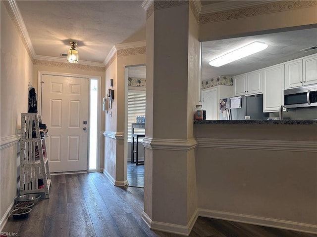 entryway with dark hardwood / wood-style flooring