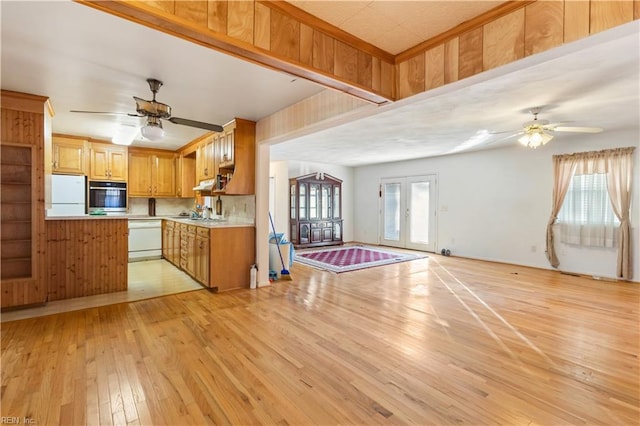 kitchen with white appliances, french doors, ceiling fan, tasteful backsplash, and light hardwood / wood-style floors