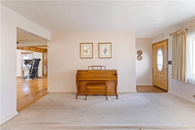 foyer entrance with light hardwood / wood-style floors