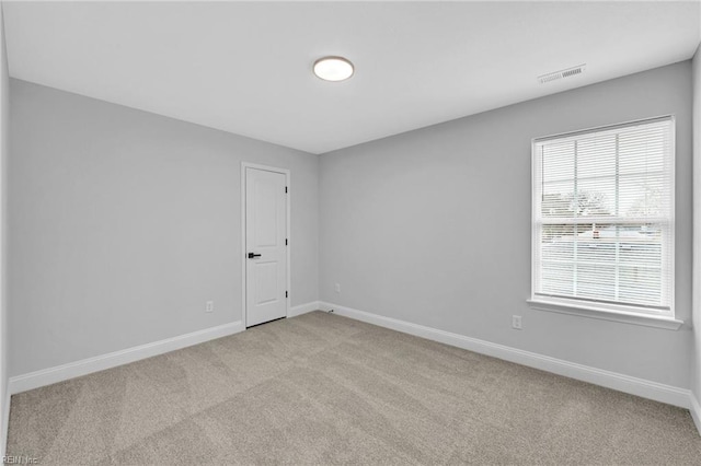 empty room with light colored carpet