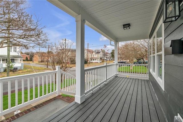 wooden terrace with a porch