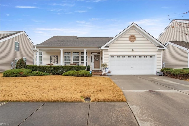 view of front of property featuring a porch and a garage