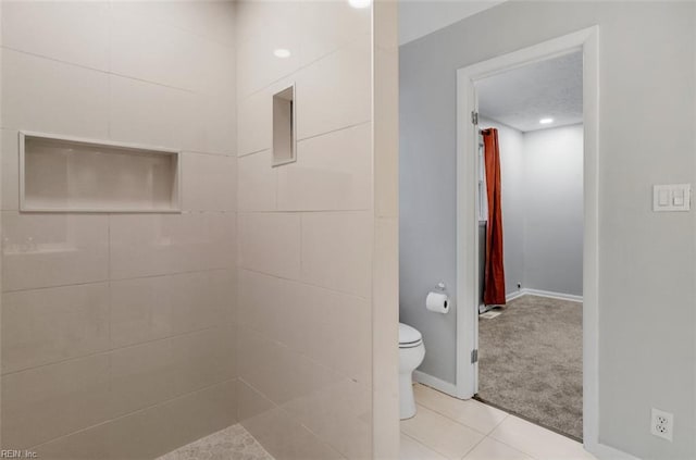 bathroom featuring tile patterned flooring and toilet