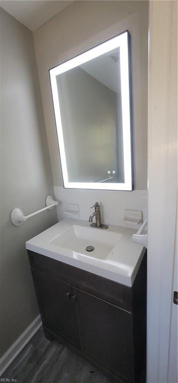 bathroom with wood-type flooring and vanity