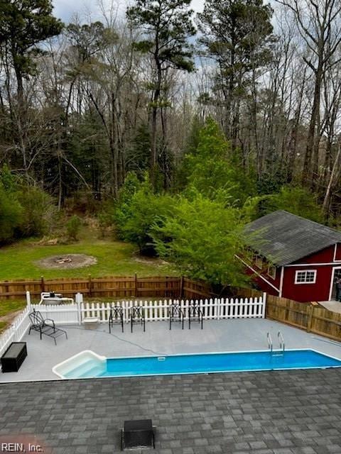 view of swimming pool featuring a patio area