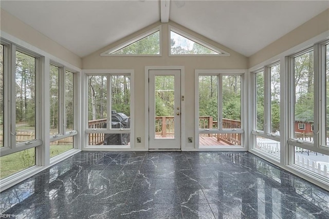 unfurnished sunroom with lofted ceiling with beams and a healthy amount of sunlight