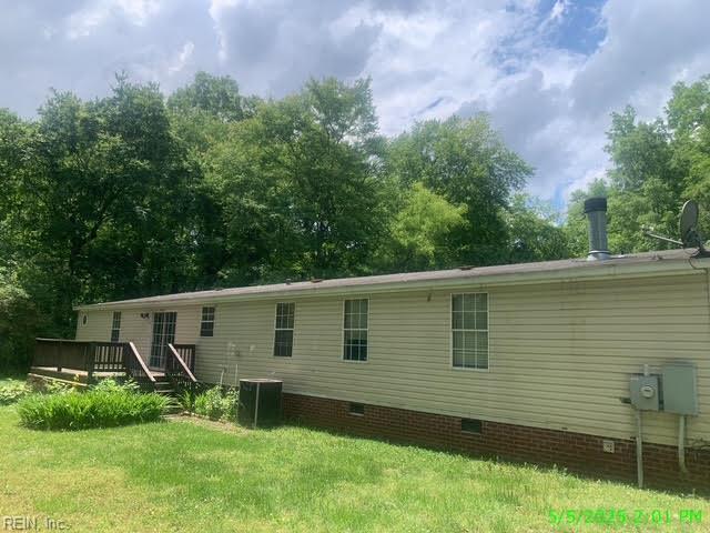 105 Chambliss Rd, Emporia, VA 23847 - back of house featuring crawl space, a wooden deck, a yard, and central AC unit