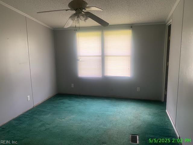 105 Chambliss Rd, Emporia, VA 23847 - spare room with a textured ceiling, ornamental molding, carpet, and a ceiling fan
