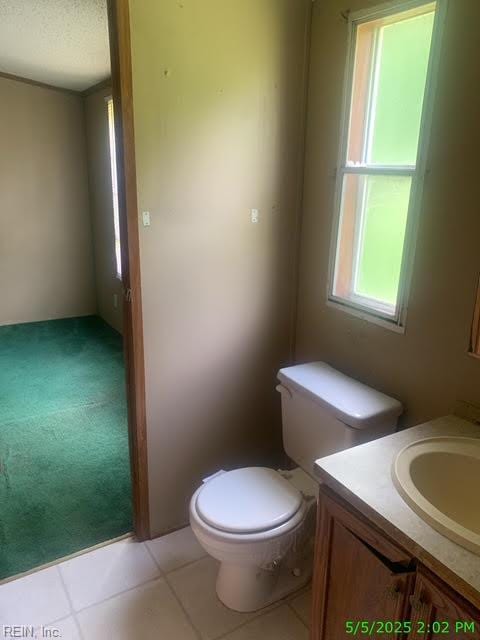 105 Chambliss Rd, Emporia, VA 23847 - half bath with vanity, toilet, and tile patterned floors