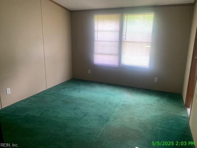 105 Chambliss Rd, Emporia, VA 23847 - carpeted spare room with ornamental molding