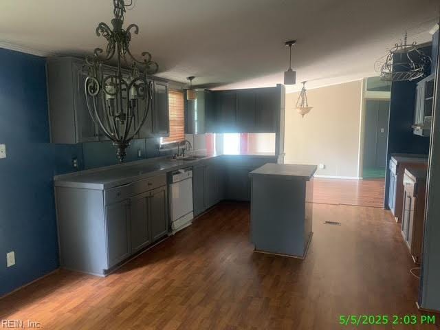 105 Chambliss Rd, Emporia, VA 23847 - kitchen featuring dishwasher, a sink, a chandelier, dark wood-type flooring, and pendant lighting