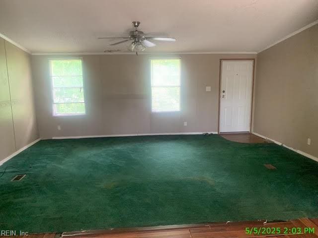 105 Chambliss Rd, Emporia, VA 23847 - empty room featuring crown molding, ceiling fan, baseboards, and carpet
