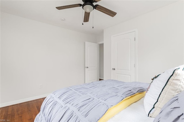 bedroom featuring ceiling fan and dark wood-type flooring