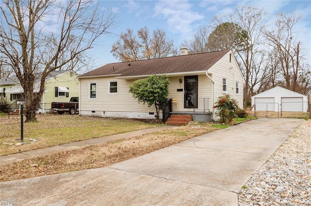 view of front of property with an outbuilding, a front yard, and a garage