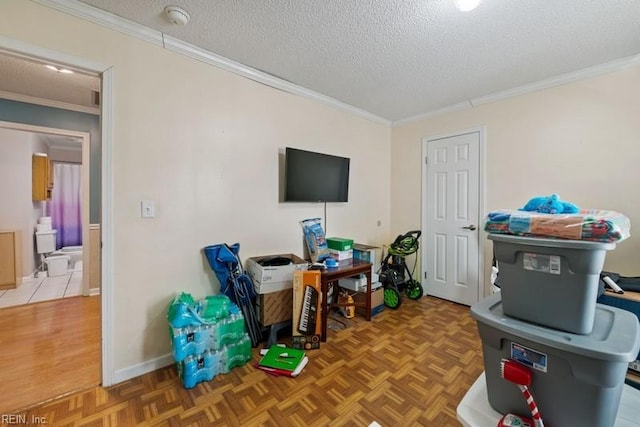 recreation room featuring crown molding, a textured ceiling, and light parquet floors