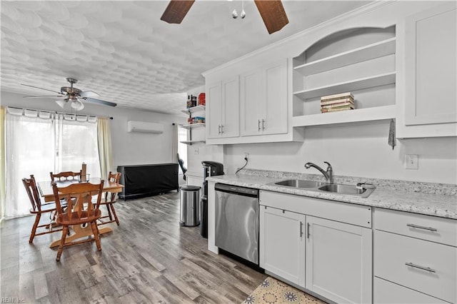 kitchen with dishwasher, plenty of natural light, and white cabinetry