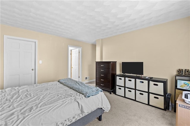 bedroom with light colored carpet