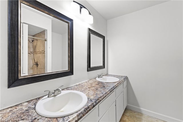 bathroom featuring tile patterned flooring and vanity